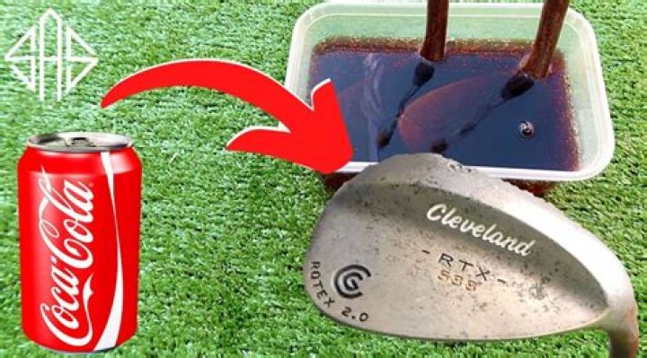 How do you clean golf clubs with Coke?