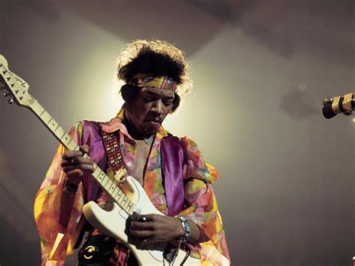 Who plays a black Stratocaster?