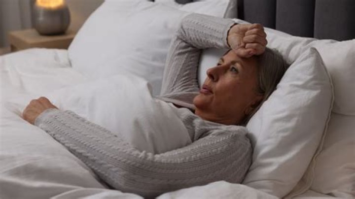 Why do I wake up sweating at night female?